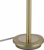 Close-up of the base and stem of a gold-colored table lamp. Voir les images du produit