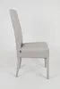 A side view of a modern dining chair. Voir les images du produit