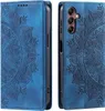 A blue flip case for a Samsung Galaxy S23 FE phone, with a mandala pattern embossed on the cover. The case is shown from the front and back. Produktbild-Vorschau