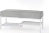 A white metal frame bench with a gray and white striped upholstered seat and two shelves underneath. Produktbild-Vorschau