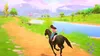 A person riding a horse through a scenic landscape with a river and mountains in the background. Produktbild-Vorschau