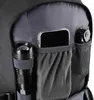 Close-up view of the interior pockets of a black rucksack, showing a flashlight, a smartphone in a clear case, and a multi-tool. Náhled obrázku produktu