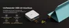 A small computer device connected to a laptop via a cable, with marketing text and icons highlighting its features. Produktbild-Vorschau