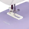 A close-up view of a sewing machine's presser foot and needle working on a piece of light purple fabric. Produktbild-Vorschau