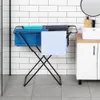 A black folding laundry rack with several towels draped over it, placed in a bathroom setting with white subway tiles and a white vanity with a sink. Voir les images du produit