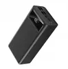 A black power bank with a digital display showing '100.' is shown at an angle against a white background. Produktbild-Vorschau