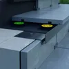 Close-up view of a modular paving system, showing adjustable pedestals supporting stone slabs. Anteprima dell’immagine prodotto