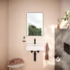 A modern bathroom with a wall-mounted sink, mirror, and accessories. Produktbild-Vorschau