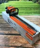 A Stihl hedge trimmer is shown on its packaging box, with a blurred green background of grass and trees. Produktbild-Vorschau