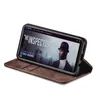 A smartphone in a brown flip case is displayed at an angle, showing a movie poster on its screen. Produktbild-Vorschau