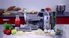 A pasta maker and ingredients are arranged on a countertop. Anteprima dell’immagine prodotto