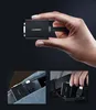 A hand holding a small black electronic adapter, with two smaller inset images showing the adapter being placed into a pocket. Voir les images du produit