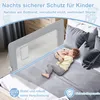 A child sleeping on a bed next to a bed rail. Voir les images du produit