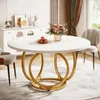 A round dining table with a golden base in a dining room setting. Podgląd zdjęcia produktu