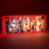 A lit-up Marvel logo sign with various Avengers characters depicted within the letters. Produktbild-Vorschau
