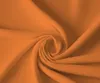 A close-up, swirled view of orange fabric. Produktbild-Vorschau
