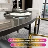 A close-up view of a modern dining table with place settings and chairs. Anteprima dell’immagine prodotto