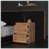 A bedroom scene with a nightstand next to a bed. Produktbild-Vorschau
