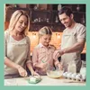 A family is baking together in a kitchen. Anteprima dell’immagine prodotto
