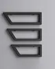 Three black metal wall consoles are mounted on a light gray wall. Produktbild-Vorschau