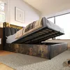A bedroom scene with a bed that has its storage compartment open, showing the mattress and bedding. Náhled obrázku produktu