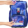 A person is holding a butterfly accessory near a backpack. Produktbild-Vorschau