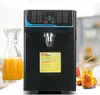 A fructose quantitative machine with a carafe of orange juice and drinks in the background. Náhled obrázku produktu