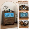 A nightstand with LED lighting and charging station, shown with various items on and in it, alongside close-up marketing shots highlighting its features. Produktbild-Vorschau