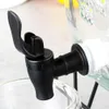 A close-up view of a black spigot attached to a glass beverage dispenser, with a glass cup positioned below. Produktbild-Vorschau