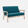 A teal upholstered loveseat with light wood legs and armrests, shown from a side-angle against a light gray background. Anteprima dell’immagine prodotto