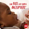 A close-up of a baby drinking from a Nuk bottle, with marketing text overlayed. Produktbild-Vorschau