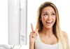 A woman is pointing at a white intercom device. Produktbild-Vorschau