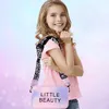 A young girl is posing with a handbag, against a pastel-colored background. Produktbild-Vorschau