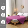 A quilted blanket is displayed on a bed, with size options shown on the left side of the image. Produktbild-Vorschau