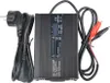 A black battery charger with cables and alligator clips. Náhled obrázku produktu