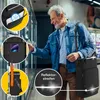 An elderly man is shopping in a supermarket, looking at products in a refrigerated aisle. He is carrying a shopping trolley. Produktbild-Vorschau