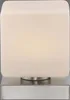 A close-up, front-facing view of a modern table lamp with a square, frosted white shade and a brushed metal base. Anteprima dell’immagine prodotto