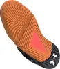 The sole of a black Under Armour sports shoe with an orange tread pattern. Anteprima dell’immagine prodotto