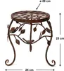 A decorative metal plant stand with a lattice top, adorned with leaf and bird motifs, shown against a white background with dimensions indicated. Produktbild-Vorschau