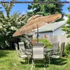 A patio set with a thatched umbrella in a backyard setting. Produktbild-Vorschau