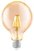 A close-up studio shot of a single, amber-colored LED light bulb with a silver screw base, isolated on a white background. Náhľad obrázku produktu