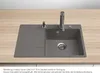 A granite kitchen sink with a faucet and soap dispenser is shown on a wooden countertop. Podgląd zdjęcia produktu