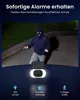 A burglar is shown in front of a security camera with a light. Produktbild-Vorschau