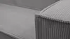 A close-up view of the corner of a gray corduroy couch. Produktbild-Vorschau