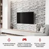 A living room with a TV mounted on a textured wall and a media console below. Produktbild-Vorschau