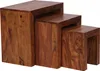 A set of three nesting tables made of dark brown wood. Voir les images du produit