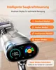A close-up of a cordless vacuum cleaner with a digital display showing battery percentage and mode indicators, set against a blurred background of a carpet and wooden floor. Produktbild-Vorschau