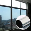 A roll of dark silver window tint film is shown in a circular inset, with a window in the background showing buildings and the sky. Produktbild-Vorschau