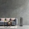 A modern living room with a gray sofa and decorative items. Produktbild-Vorschau