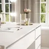 A white vanity table with decorative items and drawers, set against a window with curtains. Produktbild-Vorschau